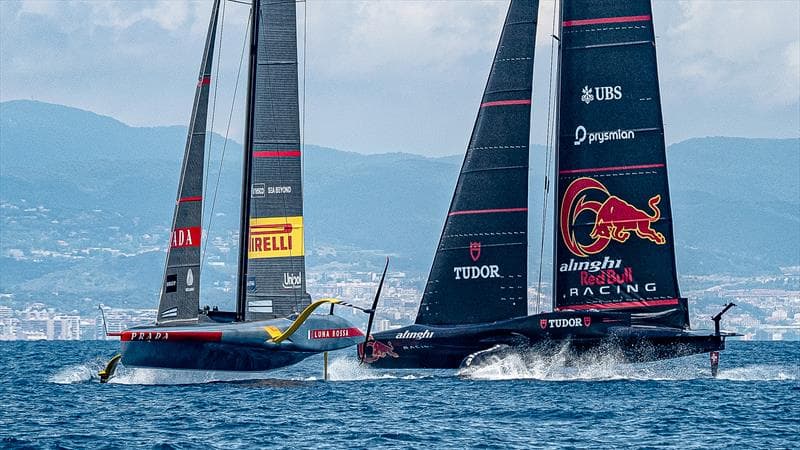 AC75 foiling yachts racing at the America's Cup in the Bay of Naples